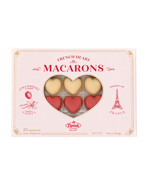 Box of French heart-shaped macarons with visible branding on a white background