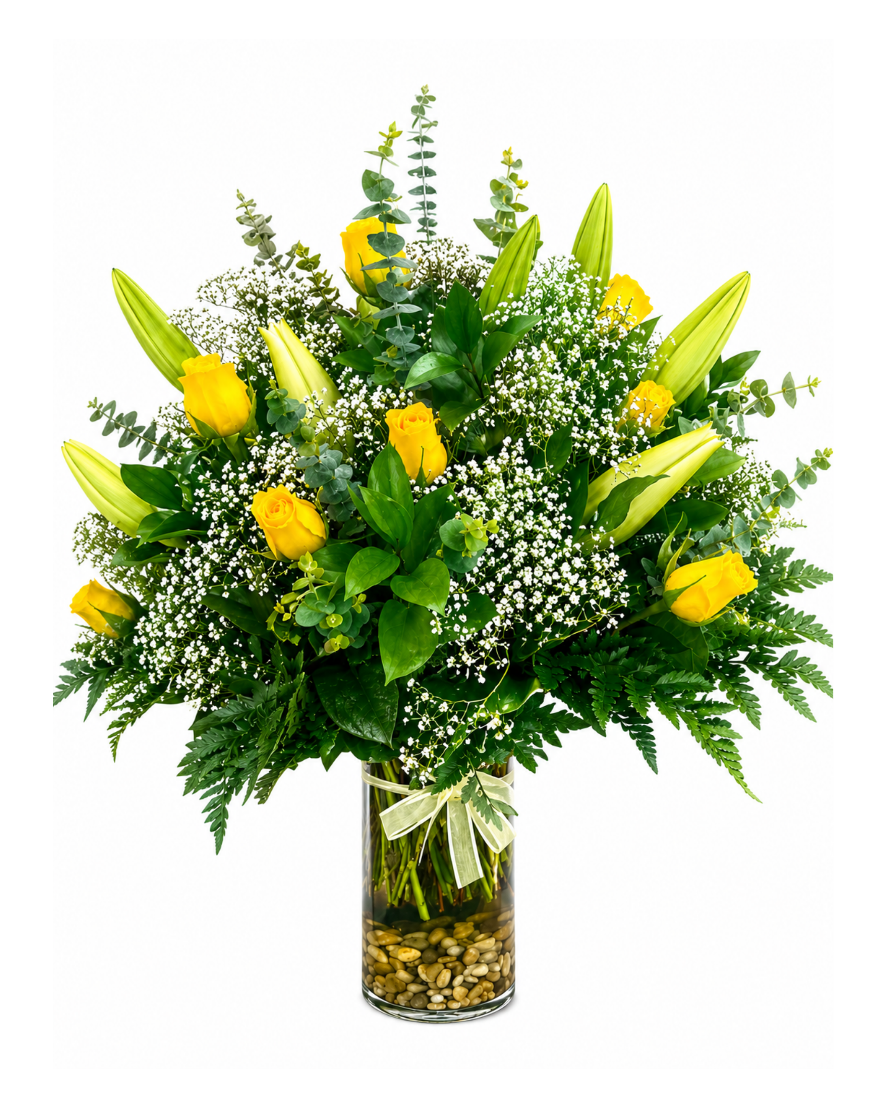 Bouquet of yellow lilies and greenery in a glass vase on a white background