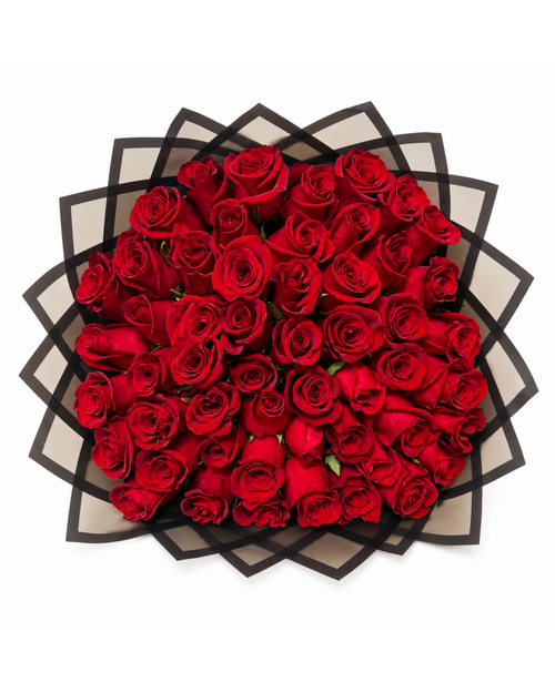 Bouquet of red roses in a decorative black and white box on a white background