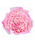 Bouquet of pink roses wrapped in pink paper on a white background