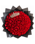 Bouquet of red roses with a tiara on a black background