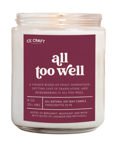Candle with a purple label on a white background