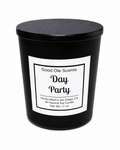 Black candle with a white label on a white background