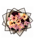 Floral arrangement in a decorative box on a white background