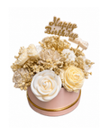 Decorative floral arrangement with 'Happy Birthday' topper on a white background