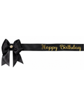 Black satin sash with gold 'Happy Birthday' text and a bow on a white background