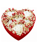 Heart-shaped flower arrangement with red, white, and beige flowers on a white background