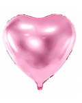 Pink heart-shaped balloon on a white background
