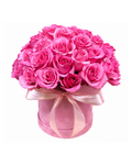 Pink roses in a pink box with a ribbon on a white background