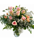 Bouquet of pink roses and white baby's breath in a clear glass vase on a white background
