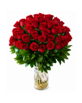 Bouquet of red roses in a clear vase on a white background