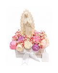 Statue of a religious figure surrounded by pink and white flowers on a white background