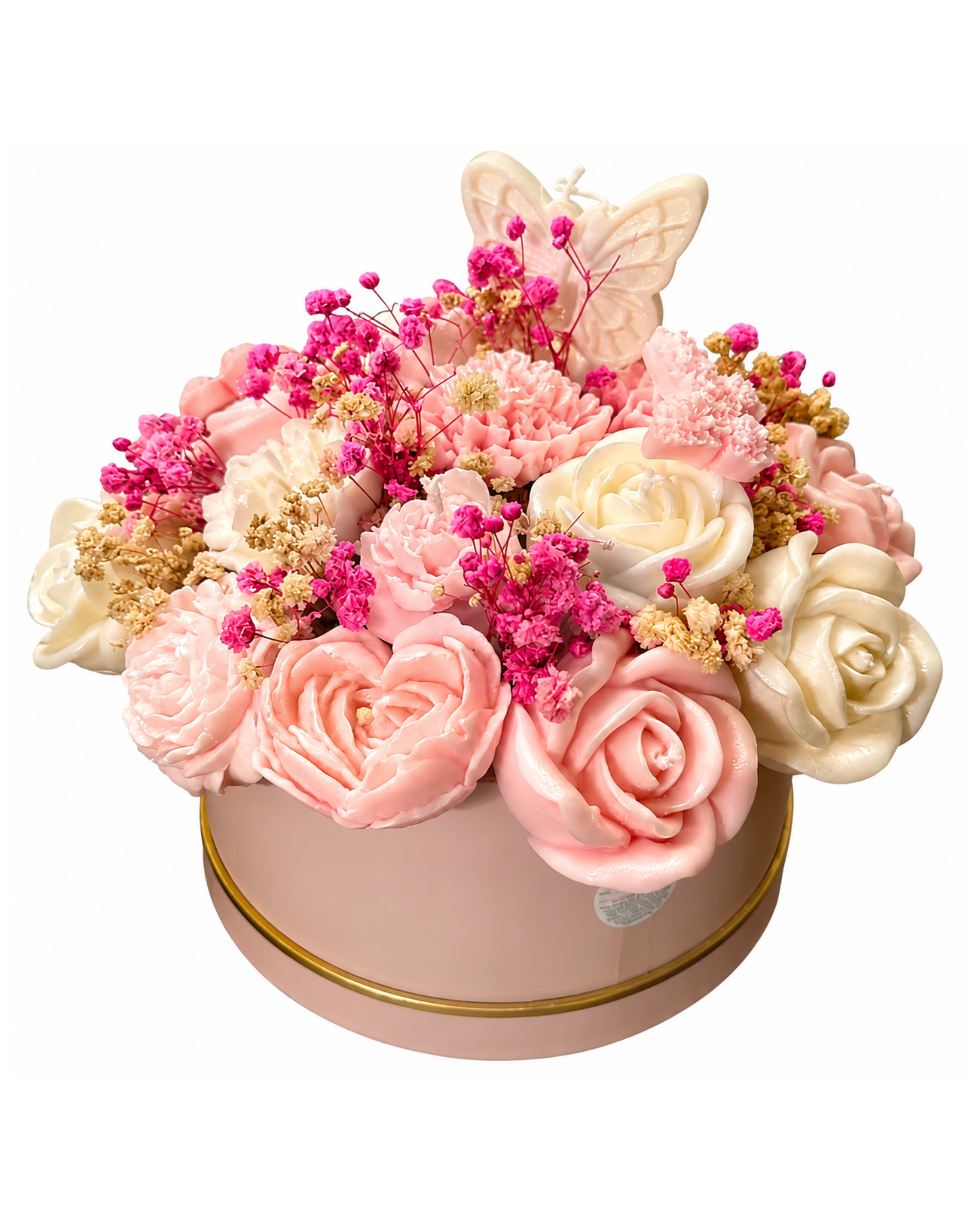 Decorative flower arrangement with pink and white flowers in a round container on a white background