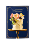 Card with a wedding cake and floral decorations on a blue background with 'Congratulations on your wedding day' text.