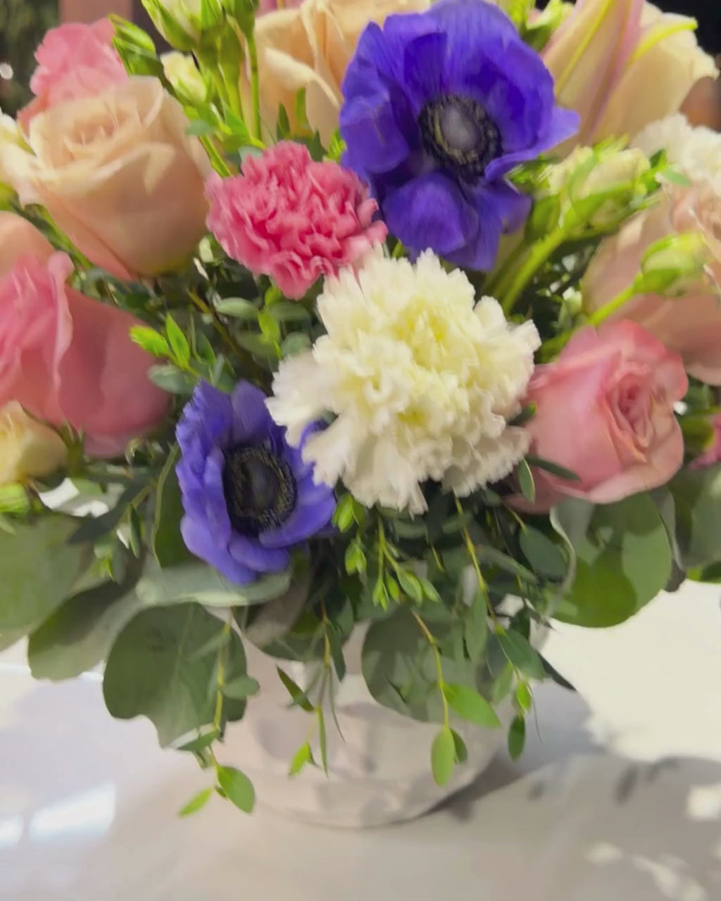 Pink Rose & Blue Anemone Arrangement in White Ceramic Vase